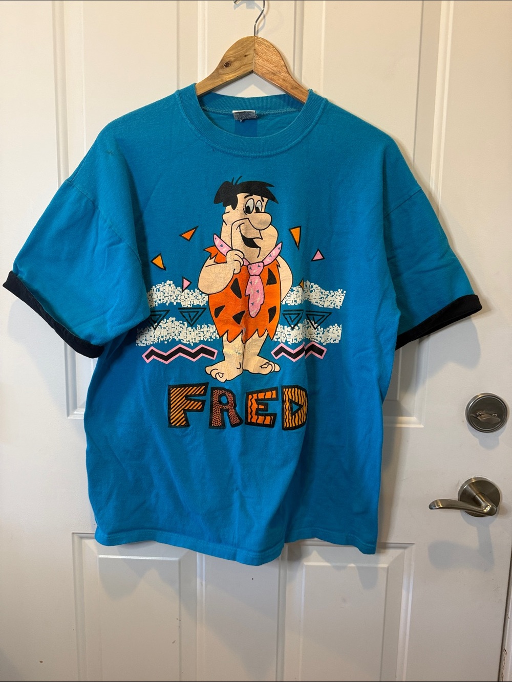 Fred Flintstone Graphic Tee — Teal with Black Trim